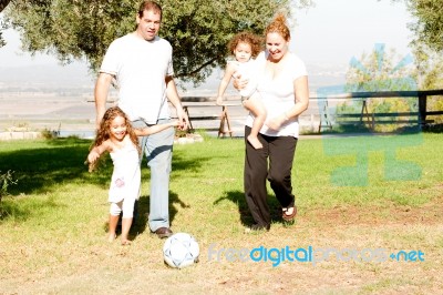 Parents Playing With Kids Stock Photo