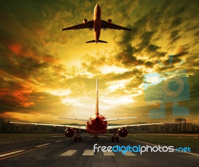 Passenger Plane Ready To Take Off On Airport Runways With Urban Stock Photo