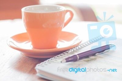 Pen And Spiral Notebook With Coffee Cup Stock Photo