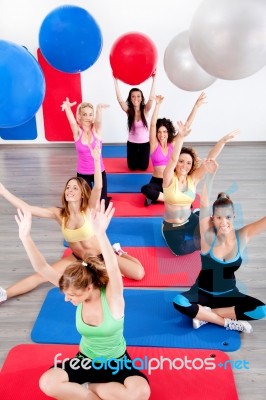 People Doing Pilates At The Gym Stock Photo