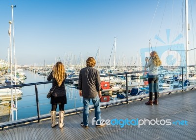 People Photographing Boats In The Marina In Brighton Stock Photo