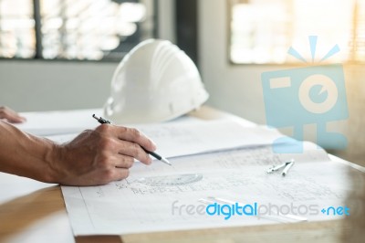 Person's Engineer Hand Drawing Plan On Blue Print With Architect… Stock Photo