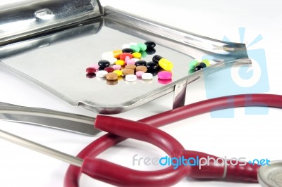 Pills And Stethoscope Stock Photo