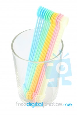 Plastic Spoons In Glass Stock Photo