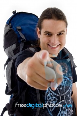 Pointing Traveler With Back Pack Stock Photo