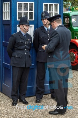 Policemen Outside An Old Fashioned English Blue Police Box Stock Photo