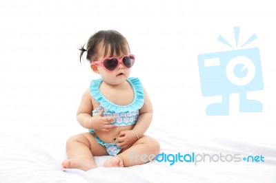 Portrait Baby Girl In Swimsuit On White Background Stock Photo
