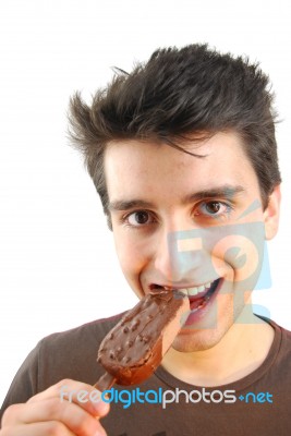 Portrait Of A Cute Young Man Eating An Ice-cream Stock Photo