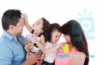Portrait Of A Nice Family Playing On White Stock Photo