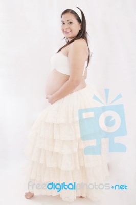 Portrait Of Adorable Pregnant Woman In Antique Dress Stock Photo
