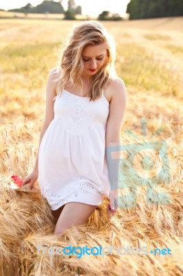Portrait Of Beautiful Girl In Field Stock Photo