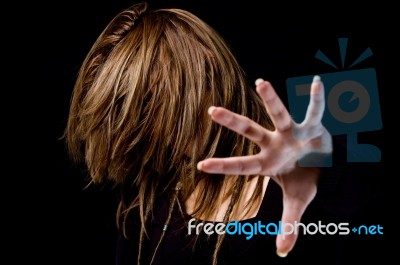 Portrait Of Female Hiding Her Face With Hair Stock Photo
