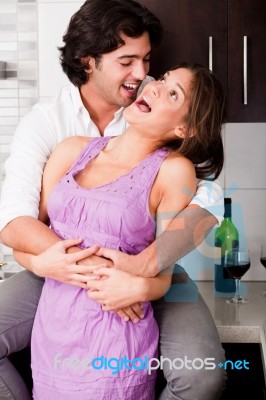 Portrait Of Romantic Young Couple Embracing Stock Photo