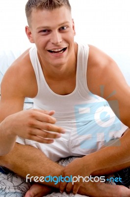 Portrait Of Smiling Man In Bed Stock Photo