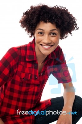 Portrait Of Smiling Woman, Semi Seated Posture Stock Photo