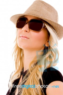 Portrait Of Smiling Woman Wearing Hat And Sunglasses Stock Photo