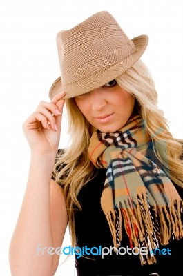 Portrait Of Smiling Young Woman Holding Her Hat Stock Photo