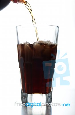 Pouring Brown Soda Into Glass Stock Photo
