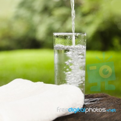 Pouring Water Into A Glass Stock Photo