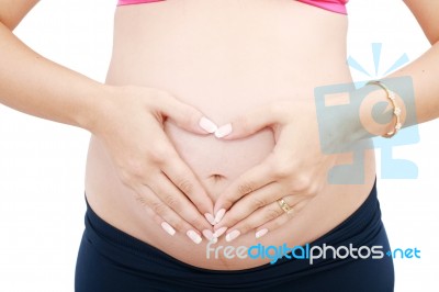 Pregnant Lady Showing Love Sign Stock Photo