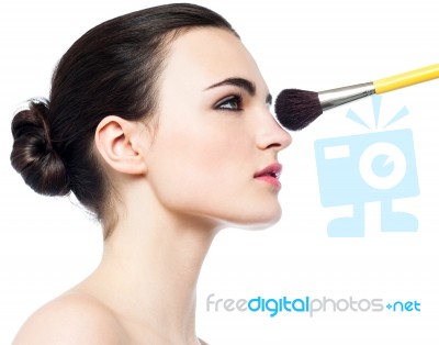 Pretty Girl Getting Makeup Applied On Her Face Stock Photo