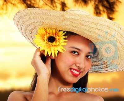 Pretty Girl In A Hat At Sunset Stock Photo