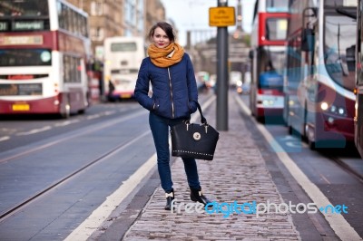 Pretty Girl Walking On The Road Stock Photo