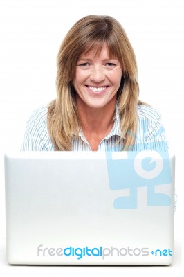Pretty Smiling Lady Working On Laptop Stock Photo