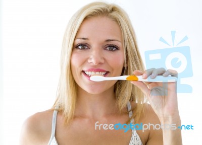 Pretty Young Blonde Woman Cleaning Her Teeth Stock Photo