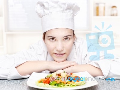Pretty Young Chef And Hers Plate Of A Delicious Salad In Kitchen… Stock Photo