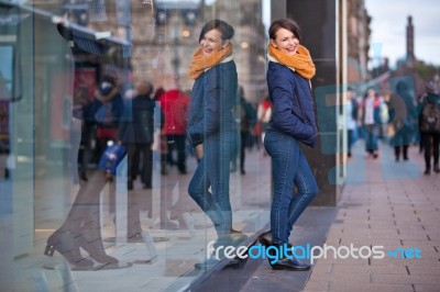 Pretty Young Girl Standing At Shopfront Stock Photo