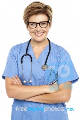 Profile Shot Of A Cheerful Middle Aged Female Doctor Stock Photo