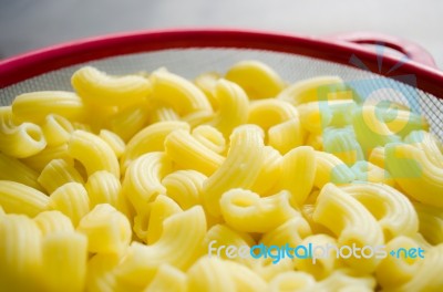 Raw Macaroni In Bowl Ready For Cooking Stock Photo