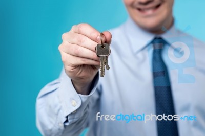 Realtor Giving The Keys To Home Stock Photo