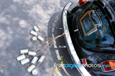 Rear View Of A Vintage Wedding Car With Just Married Sign And Cans Stock Photo