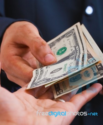 Receiving Dollars For Wages Stock Photo