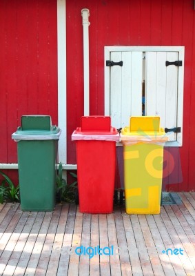 Recycle Bins In Front Of House Stock Photo