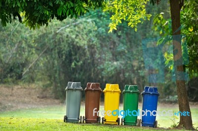 Recycle Bins In Garden Stock Photo