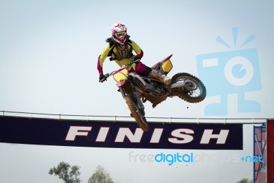 Red Motocross Winner Jump Stock Photo