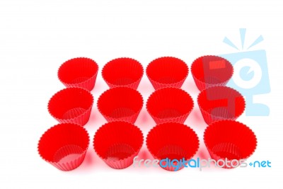 Red Plastic Cups For Small Cakes On White Stock Photo