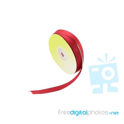 Red Ribbon Rolled Stand On White Background Stock Photo