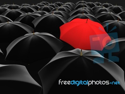 Red Umbrella Among Black  Stock Image