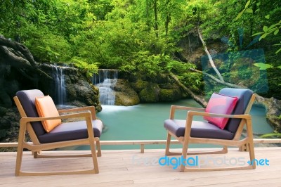 Relaxing Wooden Desk On Wood Terrace Against Beautiful Waterfall… Stock Photo
