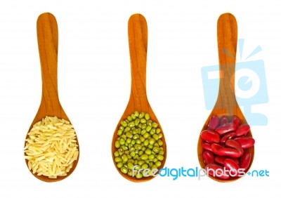Rice And Beans In Wooden Spoons Stock Photo