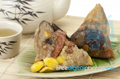 Rice Dumplings Or Zongzi With Tea Stock Photo