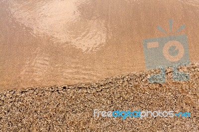 Ripple Water On The Beach Stock Photo