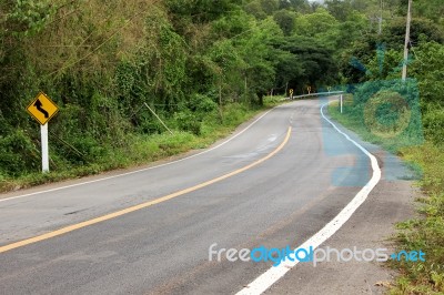 Road Curve To Mountain Stock Photo