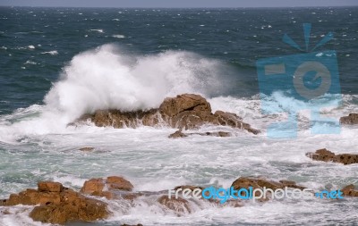 Rock And Wave Stock Photo