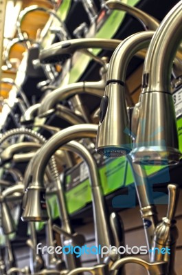 Rows Of Faucets On Display For Sale At Store Stock Photo