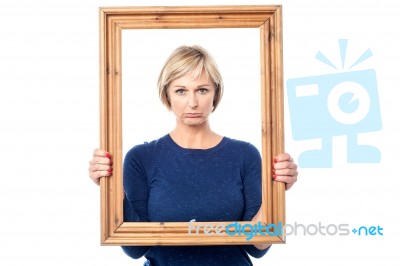 Sad Woman Holding Picture Frame Stock Photo